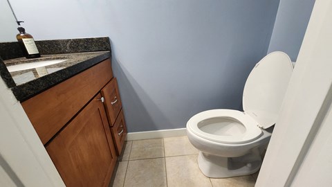an empty bathroom with a toilet and a sink