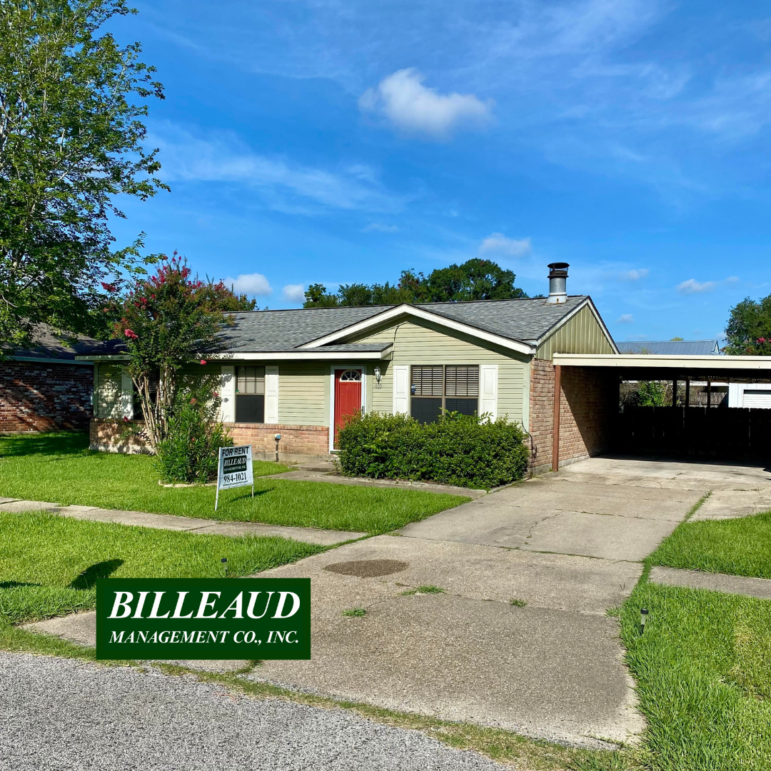 A house with a sign that says "BILLEAUD MANAGEMENT CO., INC." in front of it.
