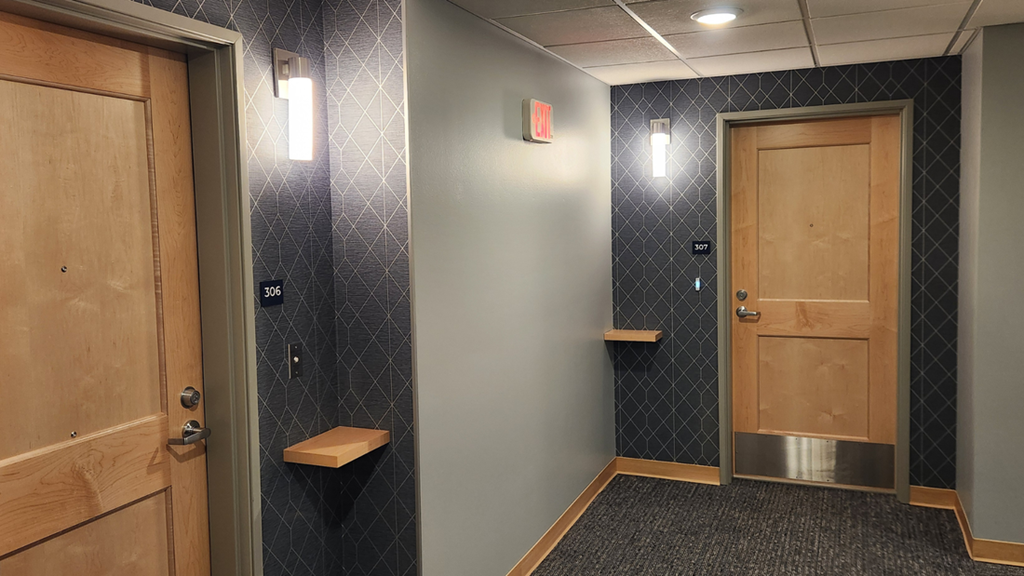 a bathroom with a toilet and a door