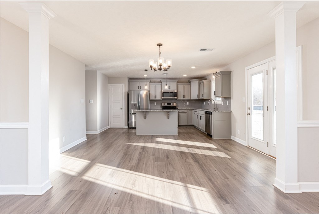 the living room and kitchen in a new home