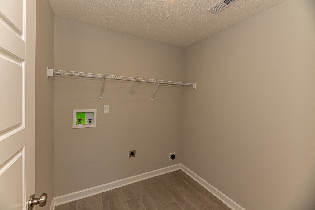 a bedroom with a hanging rod on the wall and a closet