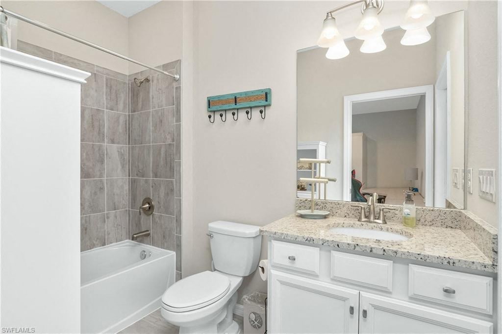 a bathroom with a sink toilet and a shower