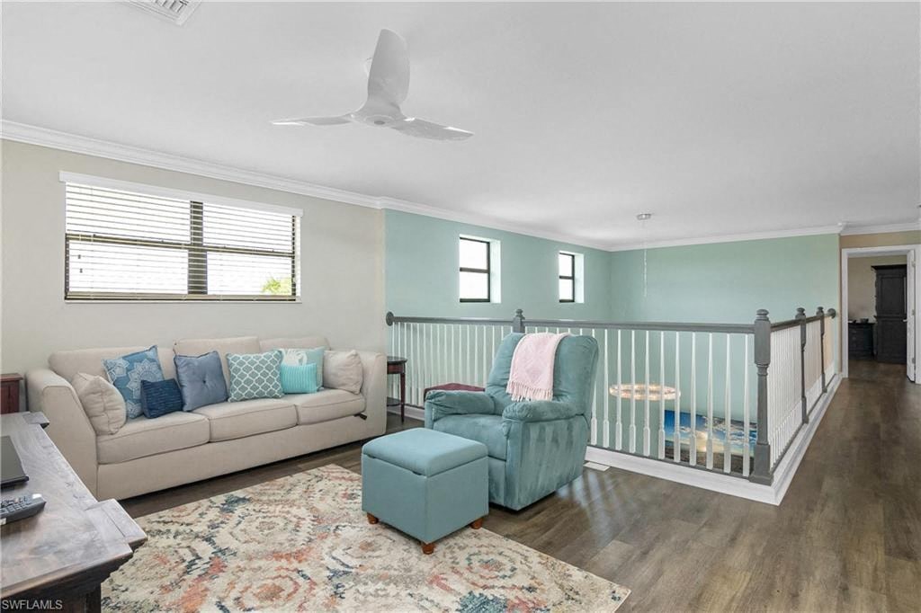 a living room with a baby crib and a couch