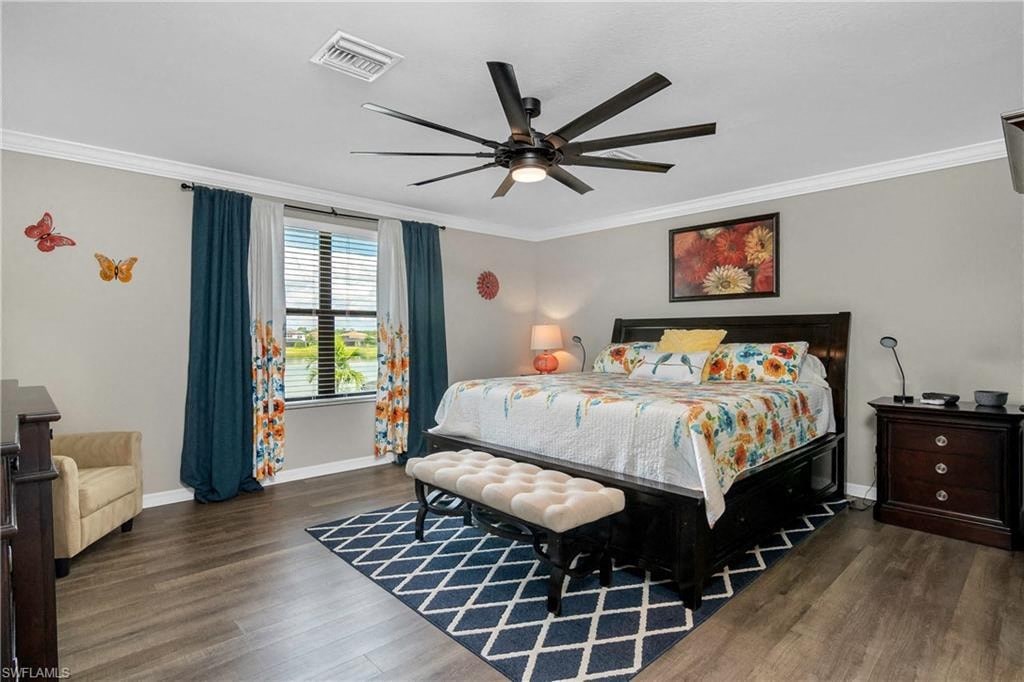 a bedroom with a bed and a ceiling fan