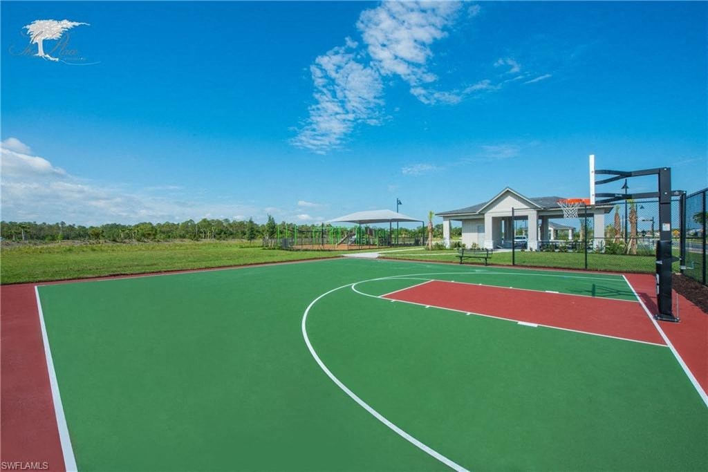 a basketball court with a building in the background