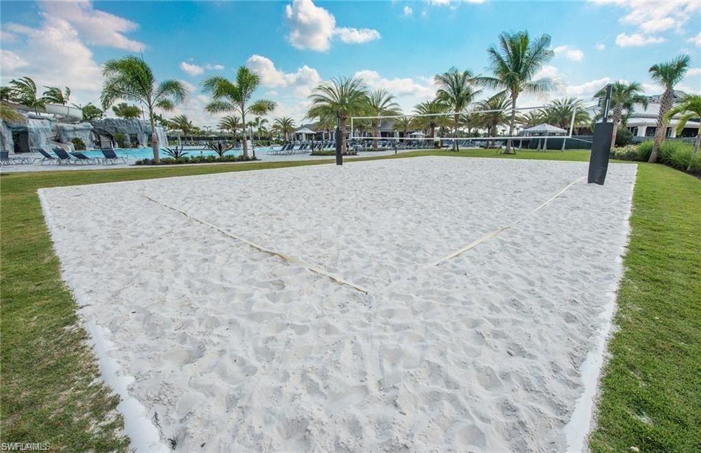 a volleyball court on the beach at the resort