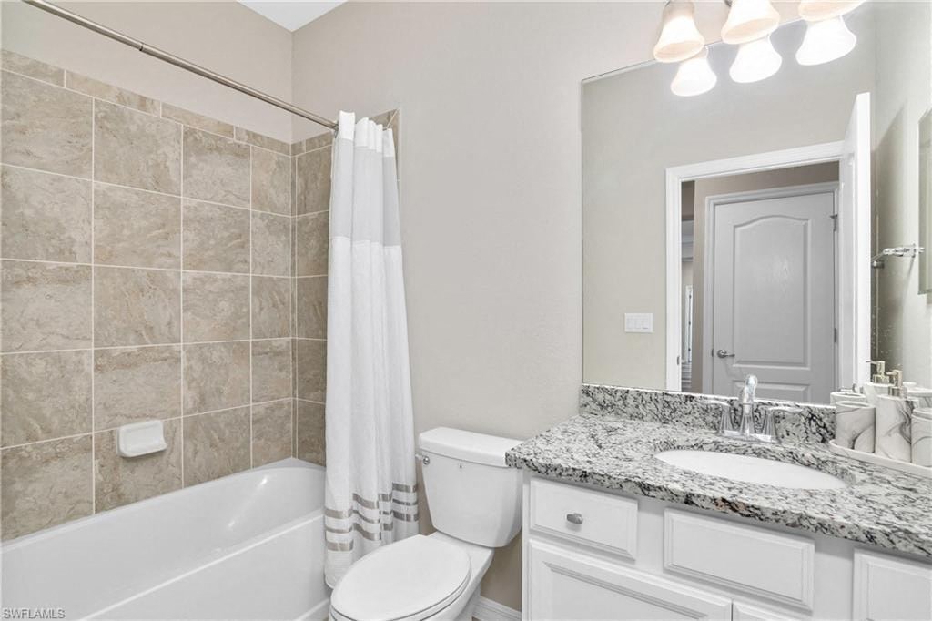 a bathroom with a sink toilet and a bath tub