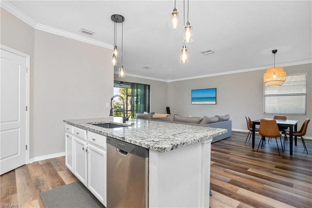 a kitchen with a counter top and a sink