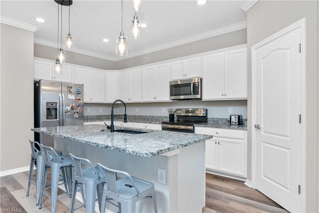 a kitchen with a counter top and a sink