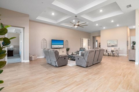 a living room with two couches and a tv