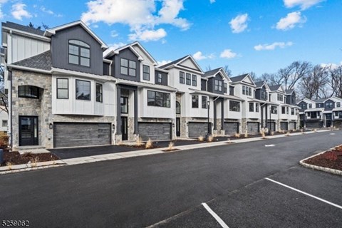 a row of houses on the side of a street