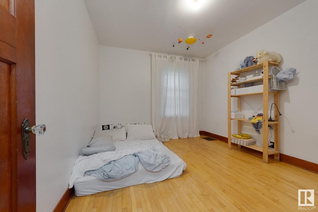 a bedroom with a bed and a book shelf