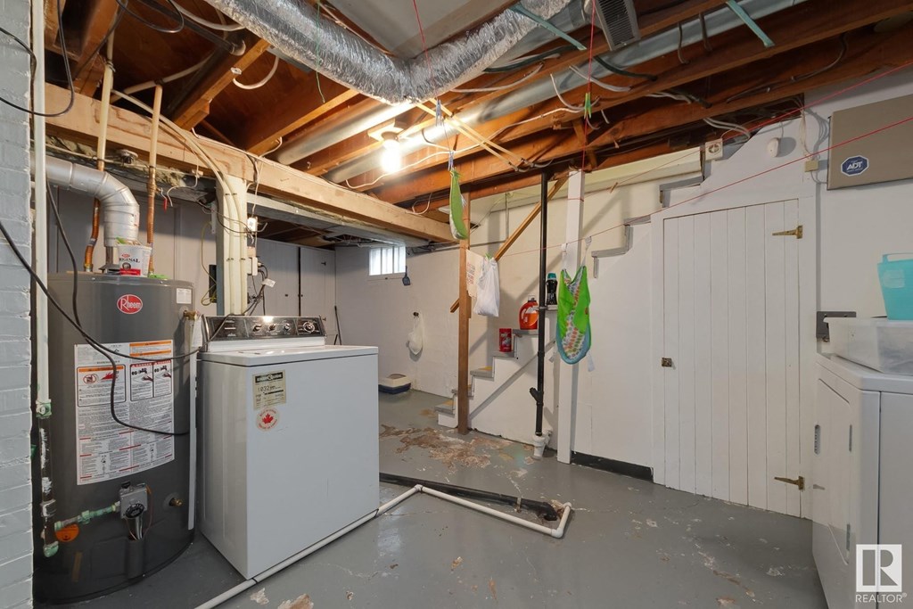 a laundry room with a washer and dryer in it