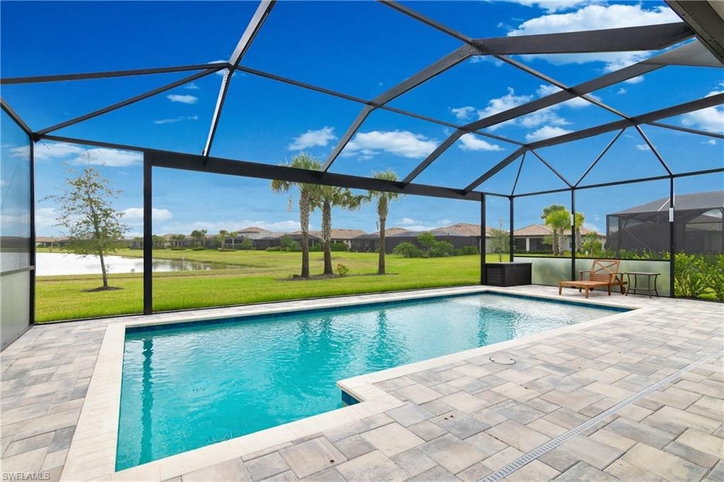 a swimming pool with a glass roof over it