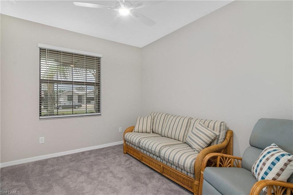 a living room with a couch and a window