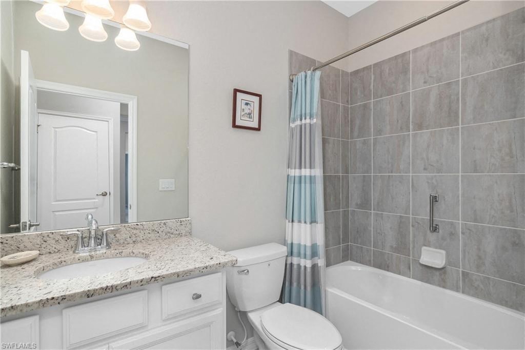 a bathroom with a sink toilet and a shower