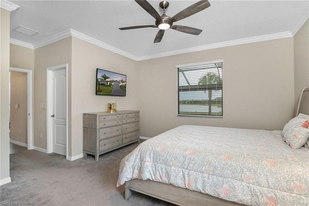 a bedroom with a bed and a ceiling fan