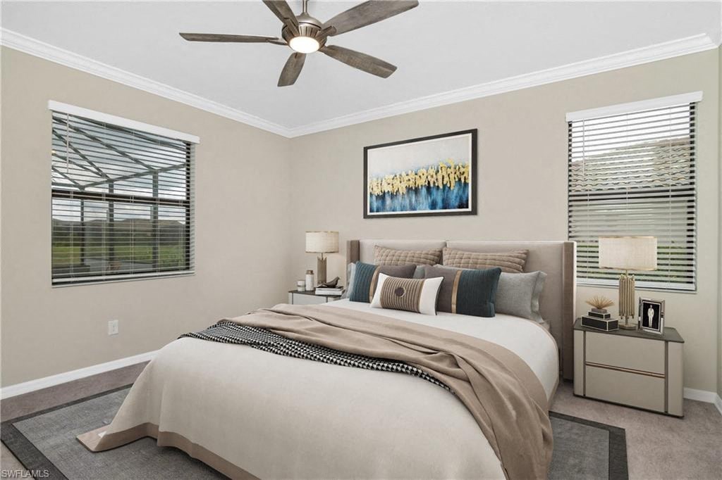 a bedroom with a large bed and a ceiling fan