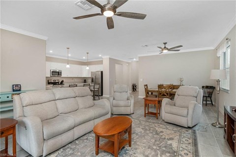 a living room and dining room with a couch and a table