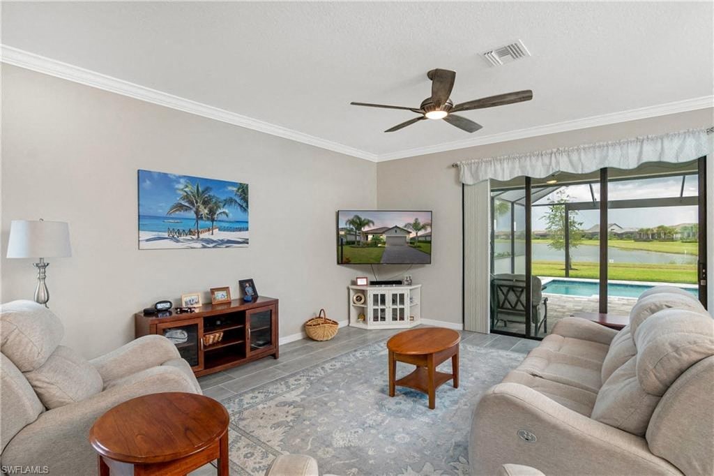 a living room with a couch and a ceiling fan