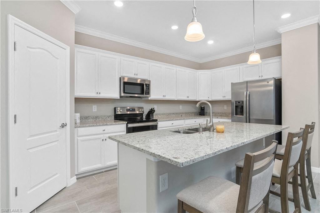 a kitchen with a marble counter top