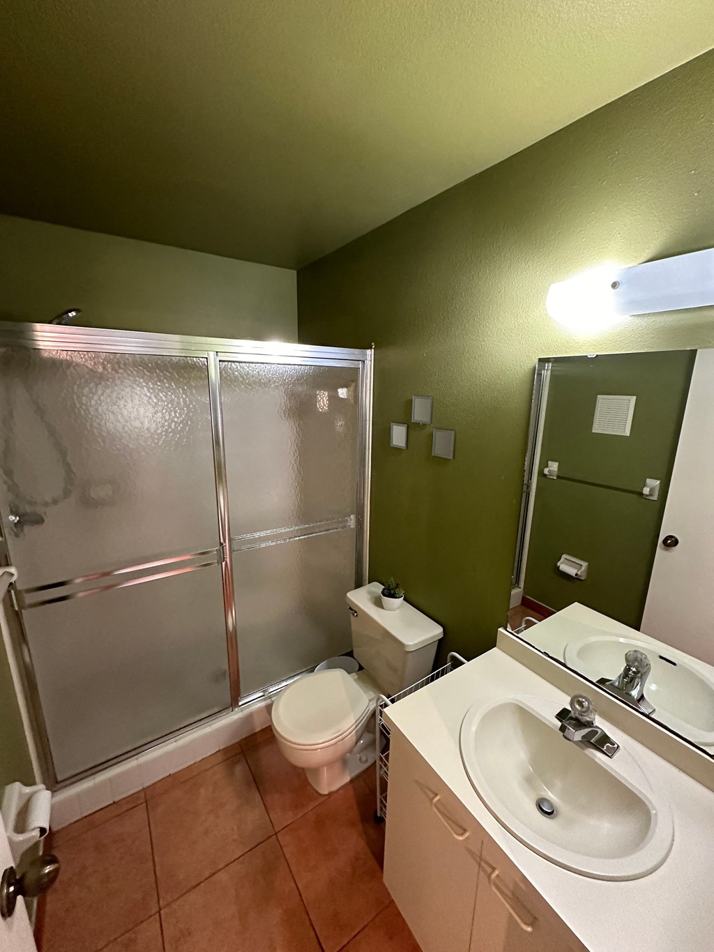 a bathroom with a sink toilet and a shower