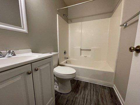 an empty bathroom with a toilet and a sink