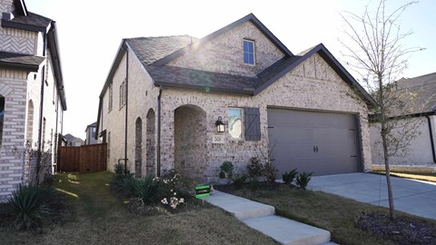 A house with a garage and a driveway.