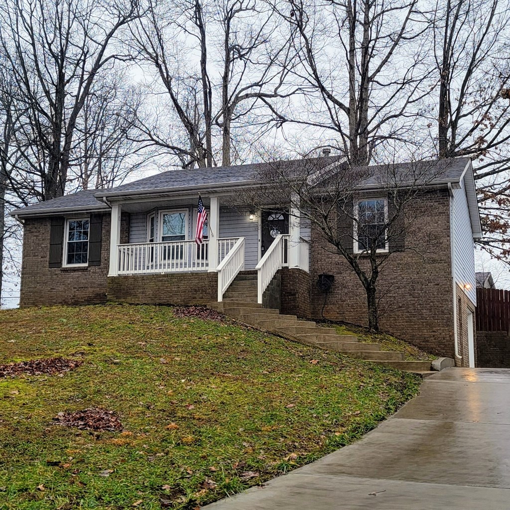 A house with a flag on the porch.