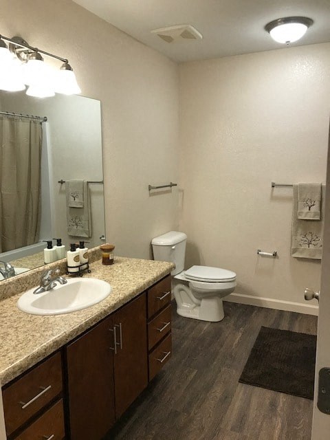 a bathroom with a sink toilet and a mirror