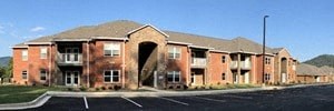 a large brick building with an arch in the front