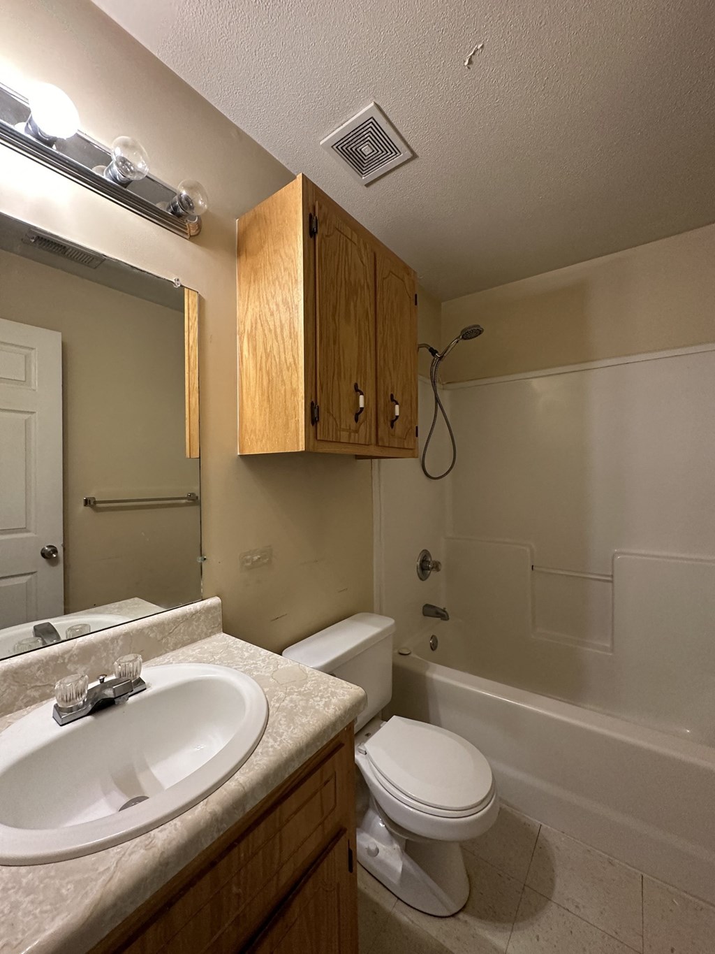 the view of a bathroom with a sink toilet and shower