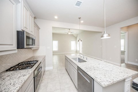 a kitchen with a sink and a counter top