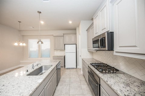 a kitchen with a sink and a counter top