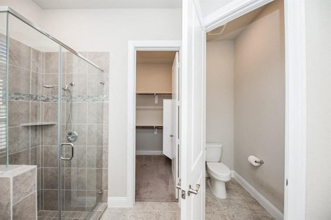 a bathroom with a shower and a toilet