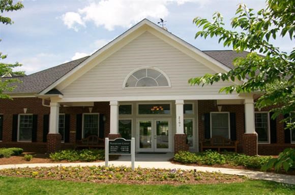 a house with a sign in front of it