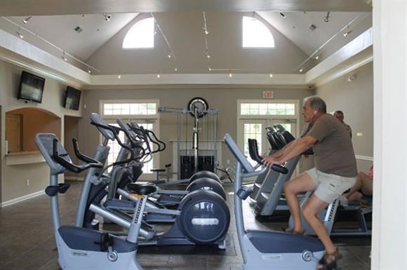 a man is on a treadmill in a gym