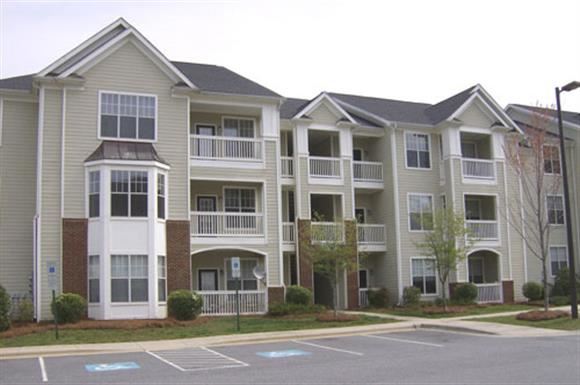 an apartment building on the side of a street