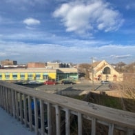 a view of a train station from a bridge