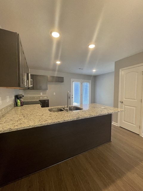 a kitchen with a counter top and a sink