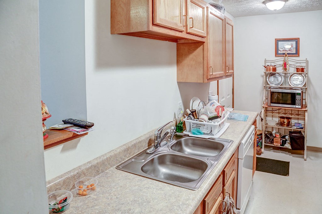 a kitchen with a sink and a counter top