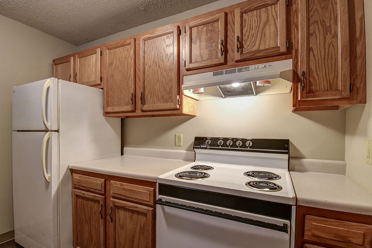 a kitchen with a stove and a refrigerator