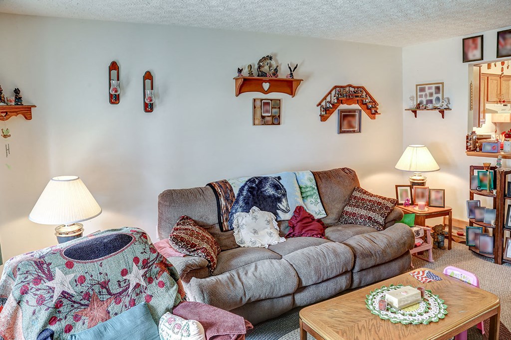 a living room with a couch and a table