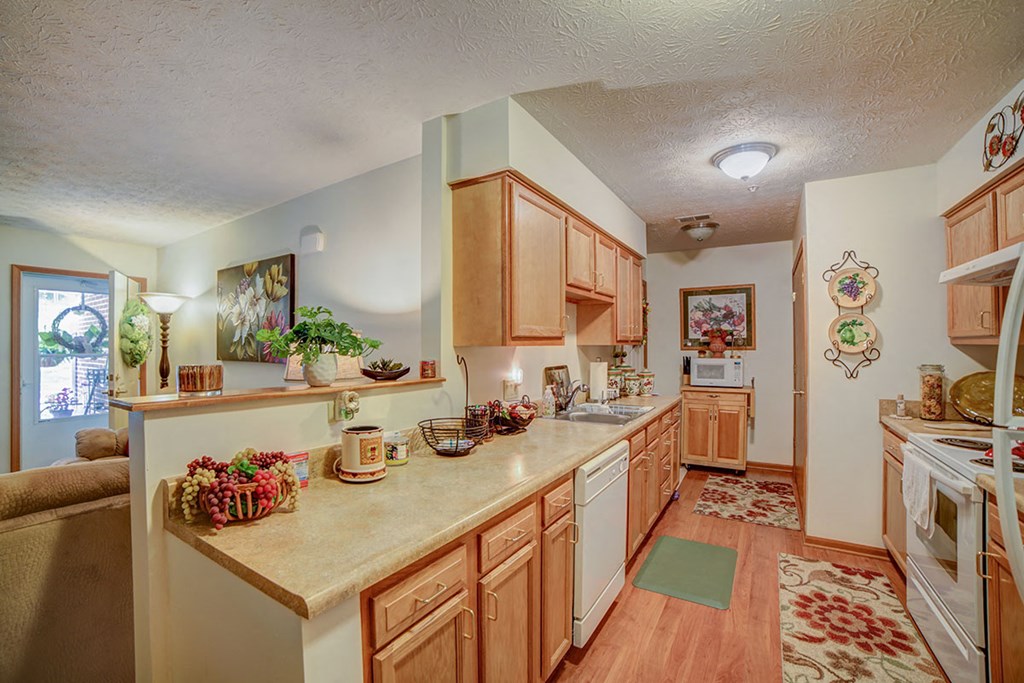 a kitchen with wooden cabinets and a counter top