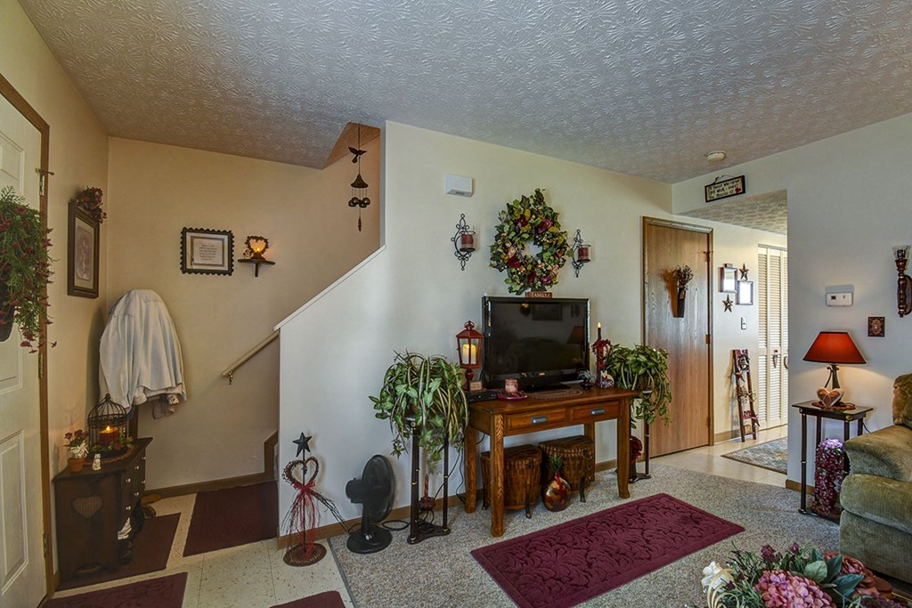 a living room with a television in the corner