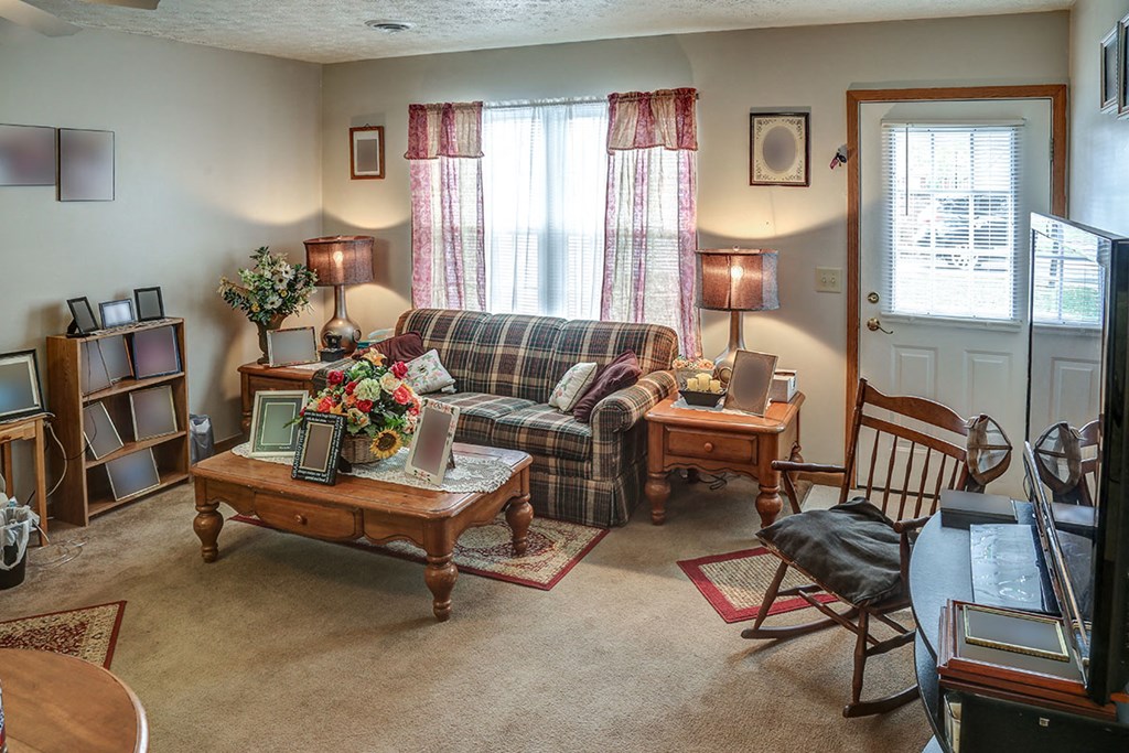 a living room with a couch and a table