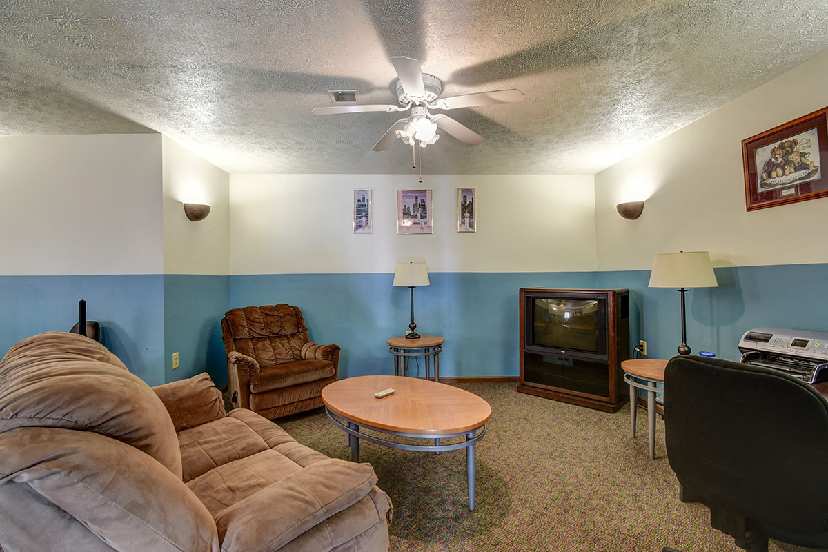 a living room with a couch and a tv