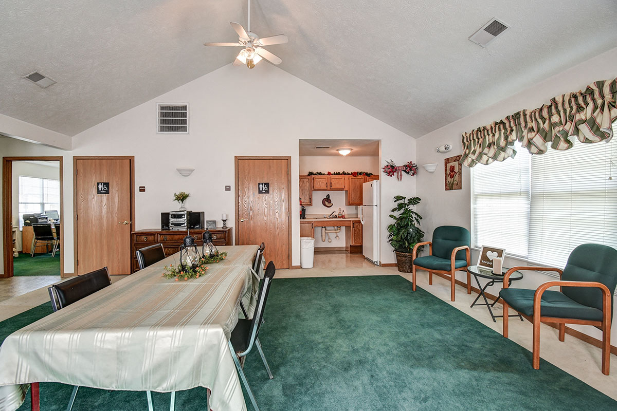 a dining room and living room with a table and chairs