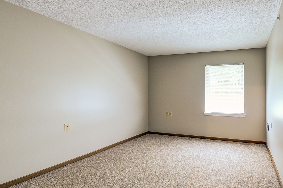 an empty room with a window in it
