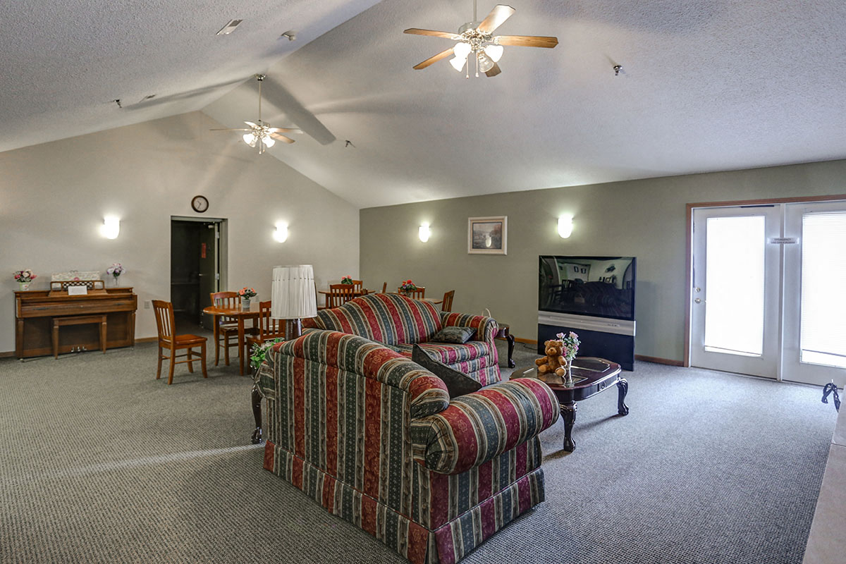 a living room with a couch and a tv
